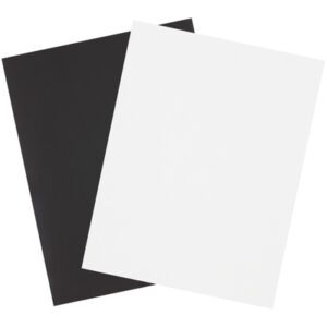Two sheets of paper, one black and one white, slightly overlap on a plain background. The left sheet resembles an MH-USA 8 1/2 x 11 Magnetic Sheet (1 label per sheet) (10/Case), while the right is white, creating a contrasting visual effect.