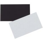 Two overlapping rectangular sheets, one solid black and the other plain white, resemble MH-USA magnetic tape strips. Positioned diagonally, they contrast sharply against the plain white background.