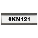 A rectangular sign with a black frame shows #KN121 in bold black on white, similar to the MH-USA 1 x 3 Magnetic C-Channel Cardholders (25/Case), combining practicality and simplicity.