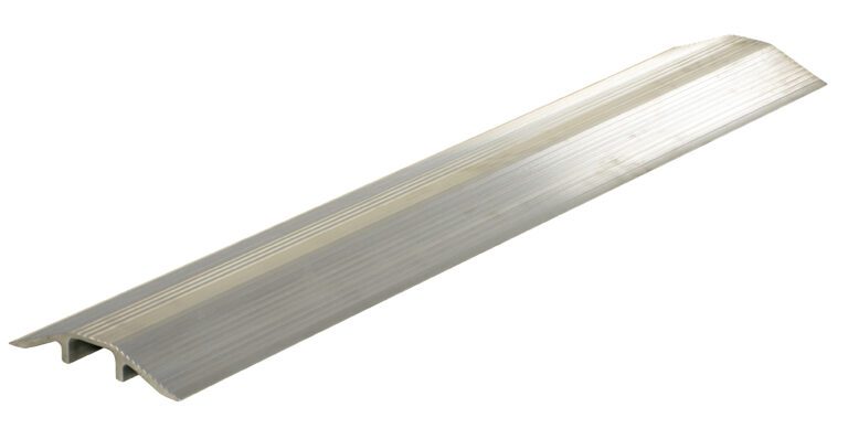The Vestil Alum Hose/Cable Crossover 48 In is an aluminum threshold strip with a grooved surface to bridge flooring gaps. Its design includes an elongated silver body, a slight arch, raised edges, and an underlying central T-shaped ridge.