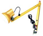 The Vestil Double Arm Sodium Dock Light, 40 inches long, resembles an industrial task lamp with a yellow finish. It features a round light head, adjustable arm with control buttons, an attached power cord, and a clamp for surface mounting.