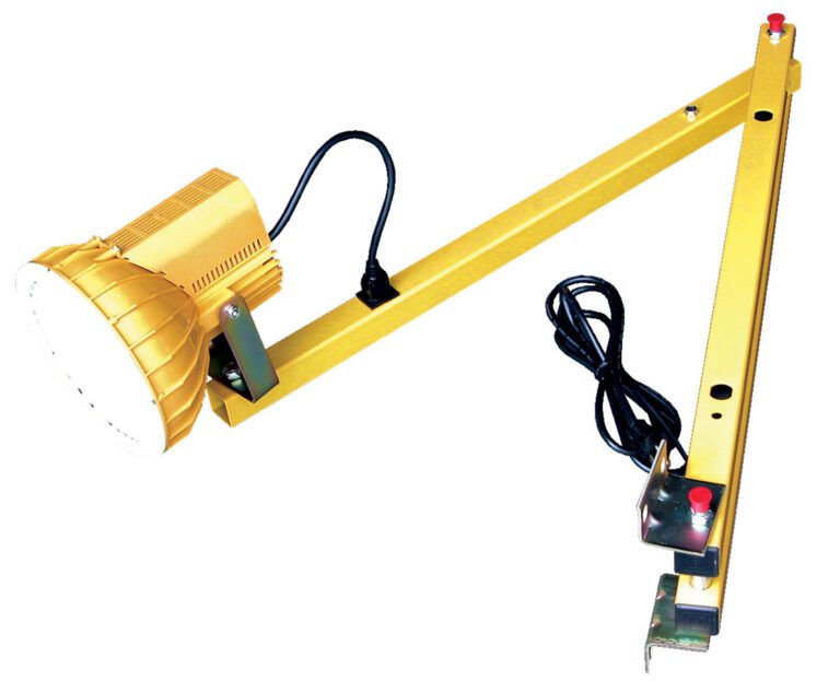 The Vestil Double Arm Sodium Dock Light, 40 inches long, resembles an industrial task lamp with a yellow finish. It features a round light head, adjustable arm with control buttons, an attached power cord, and a clamp for surface mounting.