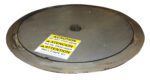 A large, round metal surface that looks like a Vestil Pallet Trk Thin Spin Carousel Ss 48 In features a warning label. The label says DO NOT STEP HERE in English, Spanish, and French, while the metal has a smooth, reflective look.