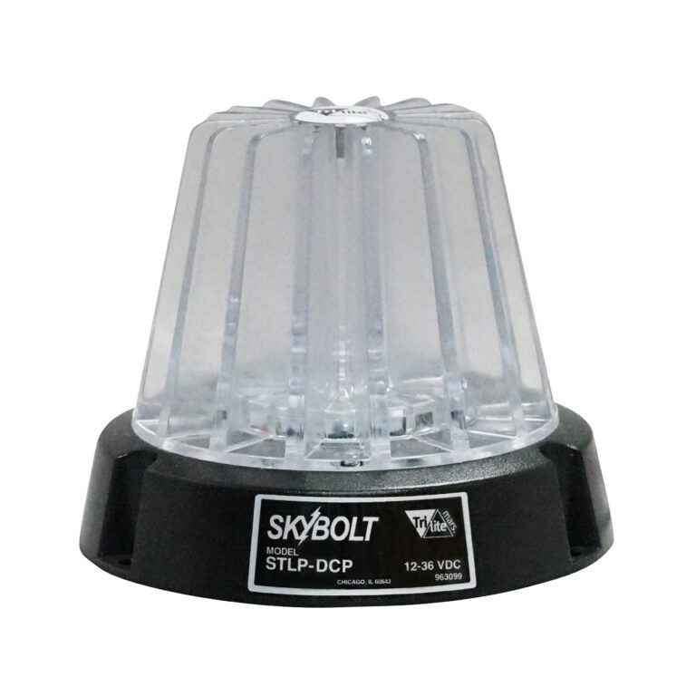 The Vestil Light, a clear round 4 dome with a black base, marked Skybolt, Tri-lite, and model STLP-DCP, is designed for dynamic environments and operates at 12-36 VDC, hinting at industrial or emergency use.