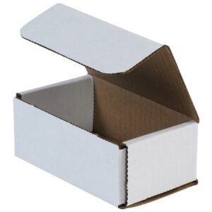 Tilt the MH-USA 5 x 3 x 2 white corrugated mailer—part of a 50/bundle—and open its hinged lid to reveal the brown interior, highlighting its rectangular shape and sturdy texture.