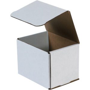 An MH-USA 5 x 4 x 4 white corrugated mailer with a hinged lid shows a plain brown interior and slightly folded edges, set against a clean white background.