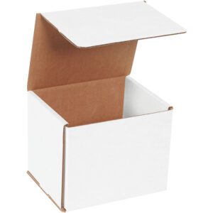 An empty MH-USA 6 x 5 x 5 White Corrugated Mailer from a bundle of 50, with its lid open showing a brown interior, is positioned against a white backdrop with the lid slightly tilted upwards.