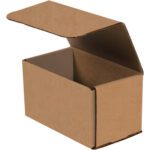 A partially open 7 x 4 x 4 kraft corrugated mailer showcases its empty interior, positioned at an angle to highlight its textured surface and simple design. Its ideal for shipping needs, with each bundle containing 50 mailers.