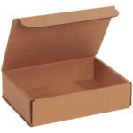 An 8 x 6 x 2 Kraft Corrugated Mailer (50/Bundle) with an ajar lid rests on a white surface. This plain, light brown box is empty, showcasing exceptional durability and style for your packaging needs.