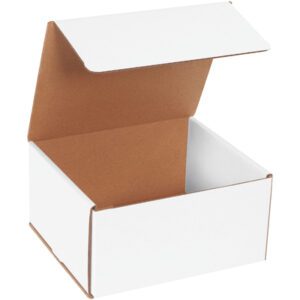 The MH-USA 8 x 7 x 4 White Corrugated Mailers (50/Bundle) have a white cardboard exterior, a brown interior, and a lid that is slightly tilted back when open.