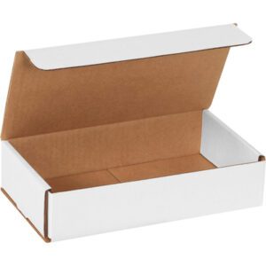 Viewed from an angle, the MH-USA 9 x 5 x 2 white corrugated mailer displays a partially open lid and empty interior. Ideal for shipping or storage, this mailer is sold in bundles of 50 for your convenience.