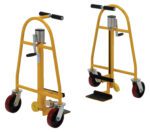 Two yellow Vestil Vend. Machine & Crate Movers Mech. 1.3K with black handles and red casters are shown in different angles. Each has a metal frame and foot pedal for lifting heavy loads, embodying precision.