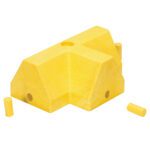 A Vestil Modular Guard Curb - T-Section, featuring a textured yellow angular block with multiple holes and a cutout section, is complemented by two small cylindrical yellow pegs.