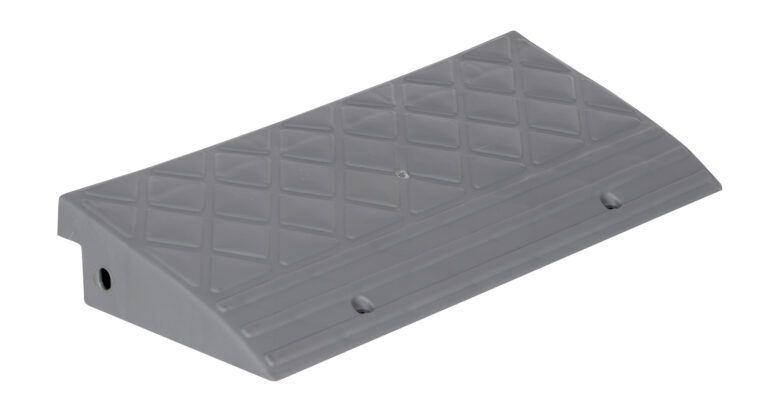 A gray rubber wheel chock with a diamond-patterned surface and a sloped design, featuring securing holes to stop vehicle rolling, shares the rugged design of the Vestil High Impact Multi-Purpose Ramp 23X10.5.