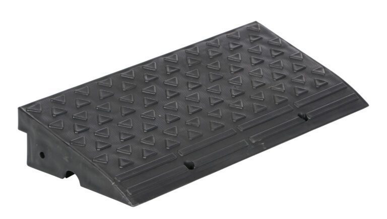 The Vestil High Impact Multi-Purpose Ramp 23.8X10.6 is a black, rectangular rubber wedge with a textured surface featuring raised triangles. It has a sloped edge and side holes for mounting or securing, measuring 23.8x10.6 inches for versatile use.