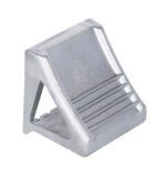 The metallic, wedge-shaped doorstop resembles the Vestil Molded Cast Steel Wheel Chock 8X 8.5 X 7, with a grooved surface and angled design featuring a hollow middle. Its shiny silver finish enhances its sleek appeal.