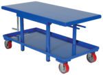 The Vestil Low Profile Mech Post Table 24 X 42 is a blue hydraulic lift table cart with a 24 x 42 surface and lower shelf. It has a side hand crank for height adjustment and moves smoothly on four wheels—two red, two gray.