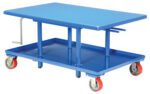 The Vestil Low Profile Mech Post Table 30 x 48 is a blue metal lift table with a rectangular surface, four vertical columns, a hand crank, red caster wheels for mobility, and an extra utility shelf beneath the top.