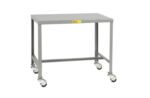 The Little Giant Mobile Steel Top Machine Table features a flat, gray metal surface and four caster wheels for easy mobility. A small yellow sticker adds character to this essential utility piece.