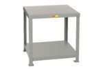 The Little Giant Heavy-Duty Machine Table features a gray metal rectangular frame, flat top, and open lower shelf with an industrial design. A small yellow label adorns the front edge, making it an ideal addition to any workshop or garage.