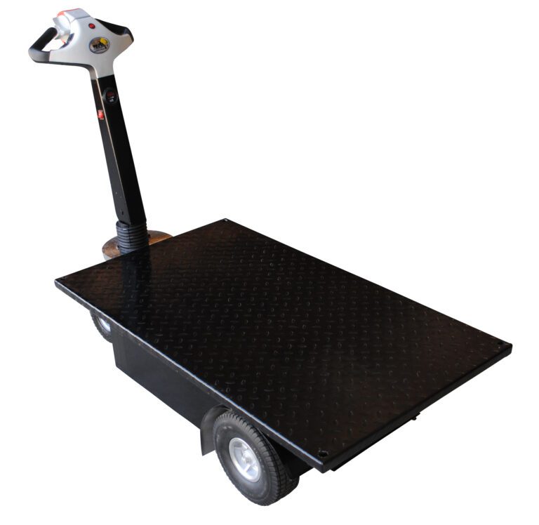 The Vestil Traction Drive Cart Platform 0.75K Lb features a black flatbed design, two large wheels, and a steering handle with intuitive controls. The platform has a diamond plate texture, and the handle is attached to one end of the cart.