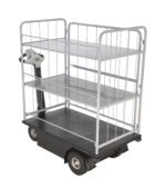 Introducing the Vestil Traction Drive Cart-2 Shelfs-Side Load, featuring two sturdy metal shelves and side railings. Its sleek black base and wheels ensure easy maneuvering with the control handle, making side loading convenient.