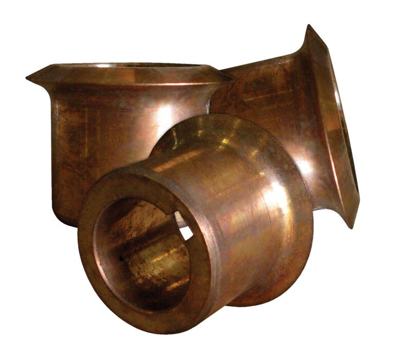 NFCW_A.jpg Three cylindrical bronze bushings from a Vestil Drum Deheader are against a white background. With flared ends and a shiny, worn surface, each measures approximately 1.5 X 2 X 2 inches.