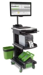 A mobile workstation with a monitor, computer, and printer on a wheeled cart. It features a green waste bin on the side, storage compartments, and green handheld scanning devices at the bottom.