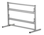 The Vestil Paper Dispenser Stand-2 Tier 36 In Wide boasts a sturdy metal frame, two horizontal bars, adjustable brackets, and wide flat legs. Painted in light gray, it elegantly contrasts a plain white background.