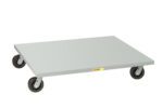The Little Giant Pallet Dollies are flat, rectangular metal tools with a smooth gray surface and four swivel casters, ideal for smoothly transporting heavy items. A small label on the side ensures reliability and ease during use.