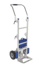 The Vestil Powered Drive Stair Climber 350# Capacity features a sturdy metal frame with two large rubber wheels and adjustable supports for efficient stair navigation. Its blue component and top handle make moving items up and down stairs effortless.