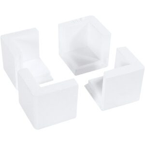 Four transparent, square, plastic corner protectors with a U-shaped design are displayed on a white background. They fit over furniture corners to prevent injury and resemble the MH-USA 3 x 3 x 3 Foam Corners (1000/Case).