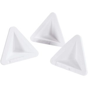 Against a white background, three white triangular corner protectors resembling MH-USA 4 1/2 x 4 1/2 x 6 3/8 Foam Corners (500/Case) are displayed. These plastic edges are designed to shield furniture corners and feature a slightly concave surface for enhanced protection.