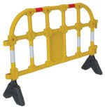 The Vestil Yellow Plastic Handrailing Section, 59 inches long, sports a grid-like pattern, sturdy feet for stability, and red and white reflective strips on a black base to effectively block or direct pedestrian traffic.
