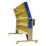 The Vestil Portable Infrared Heat Panel 61 x 44 is a large machine featuring multiple horizontal yellow panels in a blue vertical frame, supported by wheeled metal stands and angled slightly backward, indicating potential adjustability.