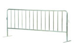 The Vestil Hd Galvanized Barrier W/Flat Feet is a sturdy silver metal crowd control barrier with vertical bars and flat feet for stability, perfect for safely managing event crowds.