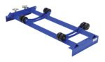 The Vestil Pallet Rack Drum Roller Cradle with blue metal frame and black rubber wheels is ideal for moving heavy objects. With two curved bars and threaded knobs for adjustment, it fits effortlessly in a standard indoor setting.