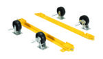 The Vestil Pallet Stand Caster Kit includes two yellow metal dolly skates with black rubber swivel casters. Each has two wheels, a sturdy metal base with safety pins, and they are aligned parallel against a white background, highlighting their function and industrial style.