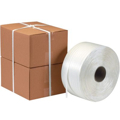 PSC588.jpg Two stacked brown cardboard boxes are secured with white packing straps next to a large roll of MH-USA 5/8 x 3000 - Poly Cord Strapping (3000/Coil) on a white background.