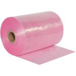 The MH-USA 18 x 2150 - 2 Mil Anti-Static Poly Tubing unfurls from its cardboard core. This lightweight, glossy pink film is ideal for effortless dispensing.