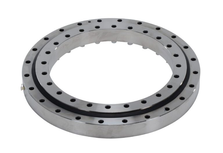 PTB-19_A.jpg The Vestil Precision Turret Bearing 19.125 In is a robust, industrial metallic ring gear featuring drilled holes around the circumference and a smooth, shiny finish. Its ideal for machinery or mechanical assemblies.