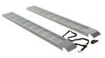 The Vestil Steel Van Ramps 72 x 18 x 2 offer metallic loading ramps with perforated surfaces for better grip, each featuring a hooked end and a safety strap with a buckle to ensure stability during loading.