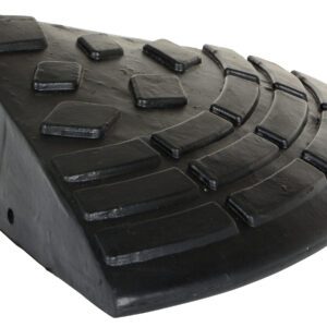 A black triangular rubber doorstop with a curved edge, featuring raised rectangles and lines for grip, mirrors the durable design of the Vestil Heavy Duty Rubber Corner Ramp.