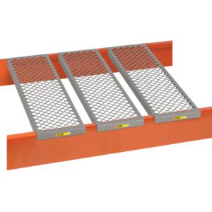 Steel grating bridge on an orange barrier with three silver grid panels for heavy-duty use, offering durability similar to Little Giant Perforated Rack Deck Channels for stability in tough environments.