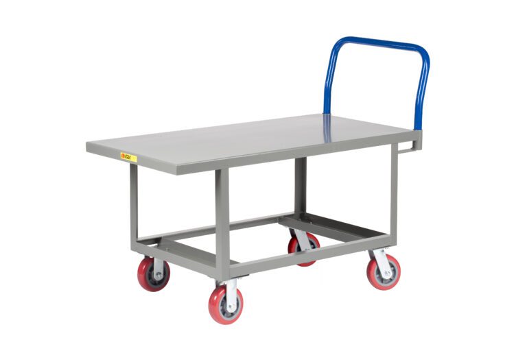 The Little Giant Ergonomic Work Height Platform Truck is a gray flatbed utility cart with four red and gray wheels. A blue handle facilitates easy maneuvering, while its open-frame design is ideal for transporting items in industrial or warehouse settings.