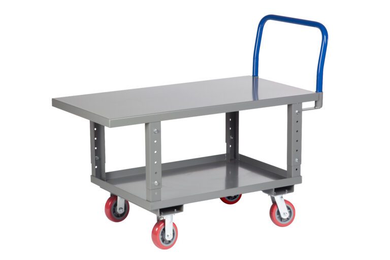 The Little Giant Ergonomic Work Height Platform Truck is a gray metal warehouse cart with flat top and bottom shelves, a blue handle, and four red and white caster wheels for easy maneuverability and efficient workspace management.