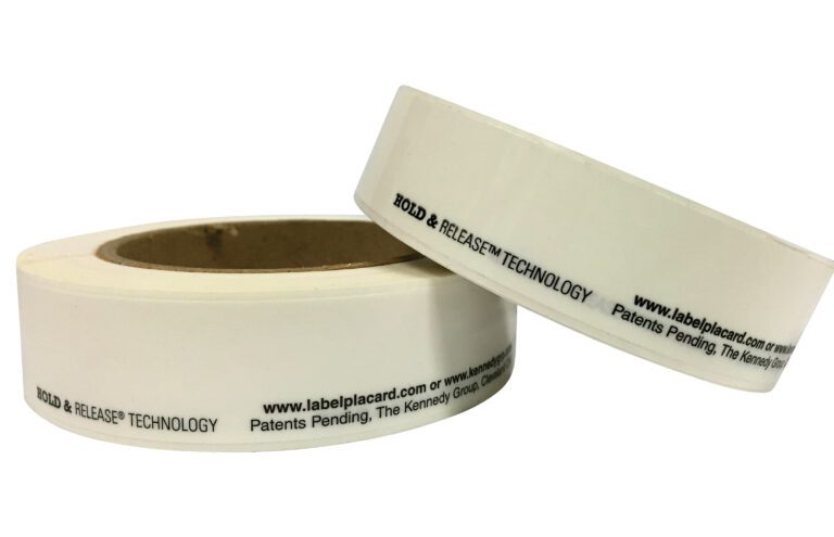 RPE-1-50_A.jpg Two rolls of white adhesive tape with black text and Hold & Release Technology feature the URL www.labelplacard.com. They read Patents pending, The Kennedy Group. Ideal for use as Vestil Economy Racking Labels, available in packs of 50 rolls per pack.
