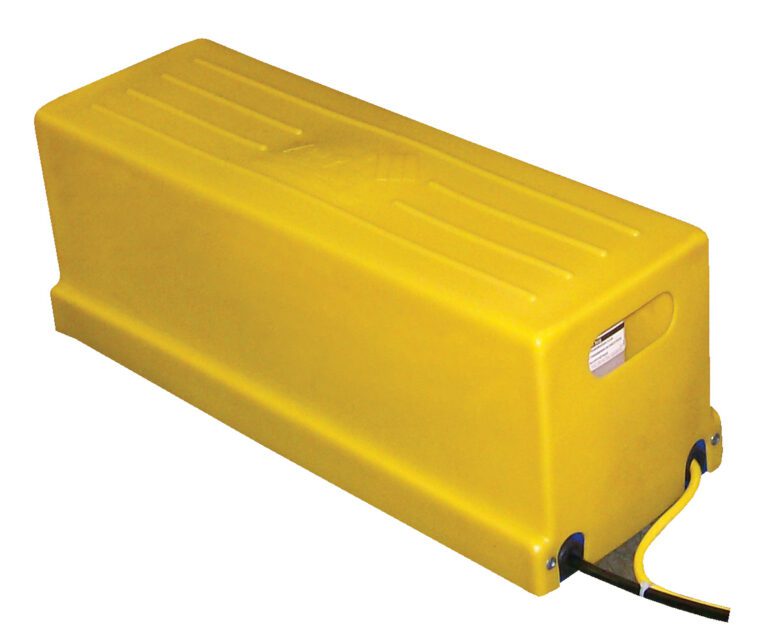 The Vestil Remotely Locatable Power Unit Assembly is a sleek, yellow, industrial battery enclosure with a large rectangular shape, smooth top, and rounded edges. It features an extending cable from the bottom right corner.