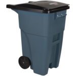The Rubbermaid® Brute® Roll Out Container - 50 Gallon, Gray, features a large design with a sturdy black lid, two wheels for easy mobility, and a convenient back handle. The slightly domed lid appears securely attached for efficient trash storage.