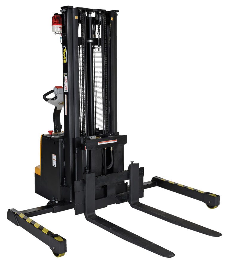 The image shows a Vestil Adjustable Extendable Fork Stacker in black, featuring long forks and a control handle. It has a yellow base with striped safety markings, designed for efficient lifting and transport of heavy loads.